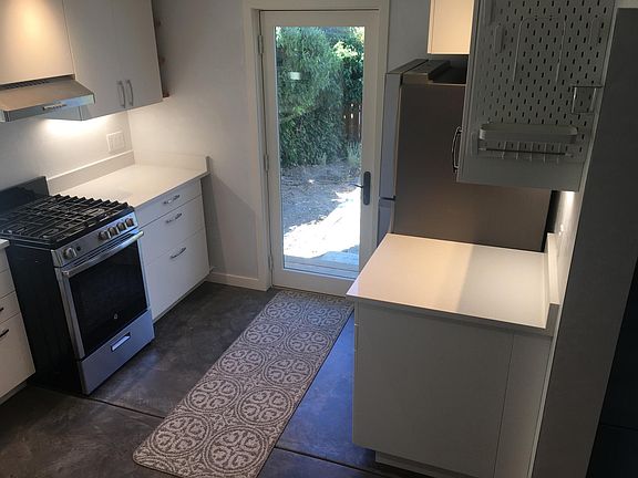 Lots of storage in bright kitchen.