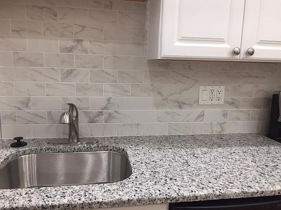 Kitchen Granite Countertop with Porcelain Tile Backsplash & SS Sink