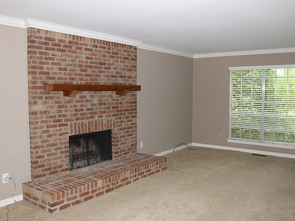 Living Room
						:
						Beautiful wood burning fireplace.