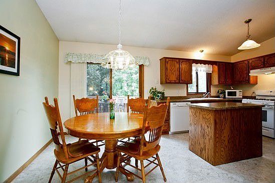 Walk through the patio doors from the dining room to the upper deck.