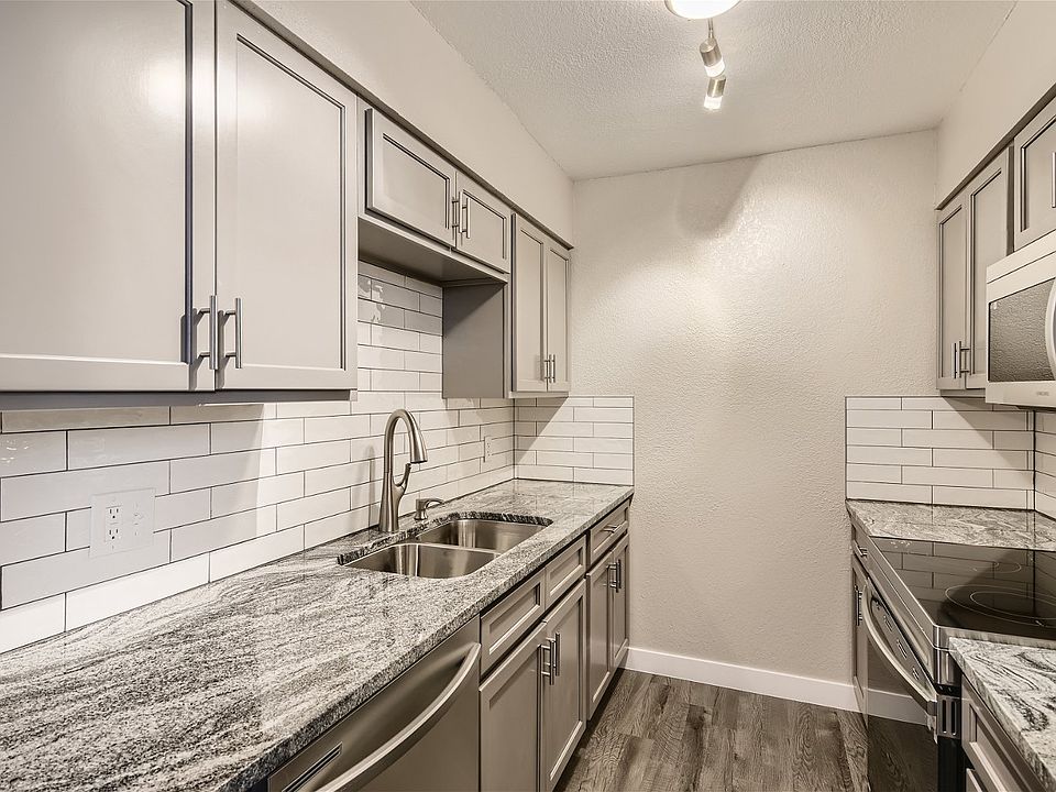 Updated kitchen with new cabinets, granite countertops, and stainless steel appliance.