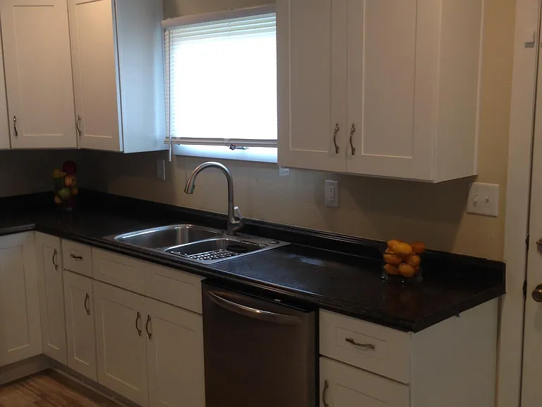 Numerous high-end kitchen cabinets.