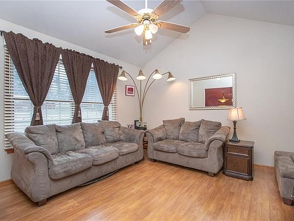 Soaring cathedral ceilings give airy height & character to the main floor greatroom.