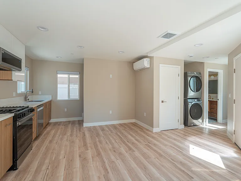 Downstairs living area with in unit washer and dryer