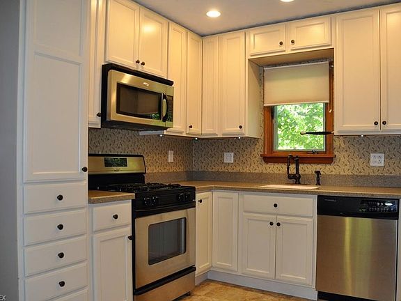 Remodeled and Updated Kitchen with Stainless Appliances, Newer Cabinets, and Solid Surface Countertops.