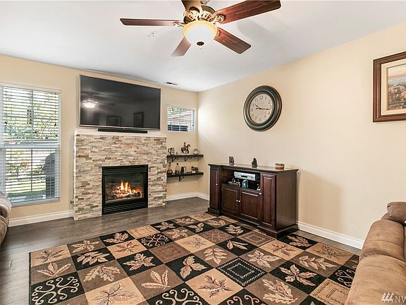 Warm and inviting living room with new fireplace surround and plenty of space for comfy sofas perfect for watching your favorite shows.