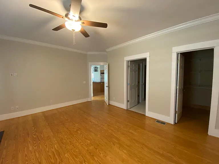 Master bedroom, with ensuite bathroom. One walk-in closet in the bedroom and a second, larger closet in the bathroom.