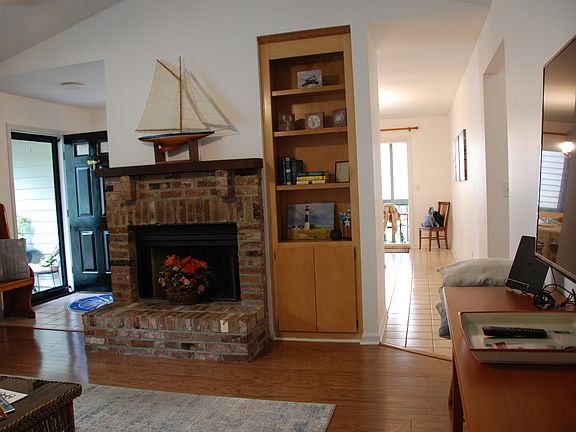 LIVING ROOM, DECORATIVE FIREPLACE, AND TV