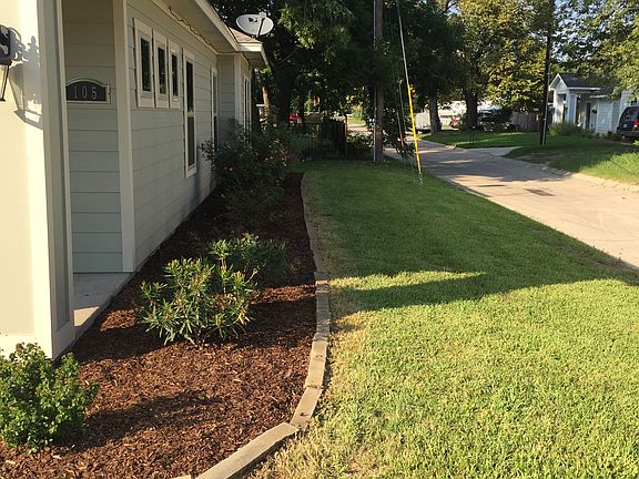 Side yard with flower bed