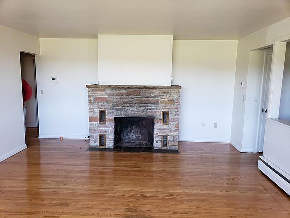 another view of the living room showing the open view concept to the dining room