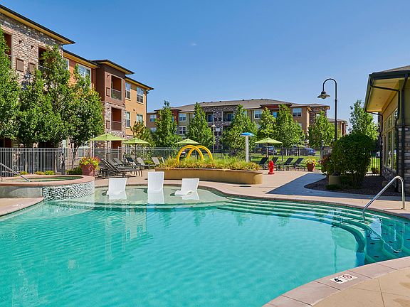 Resort-inspired pool with tanning shelf