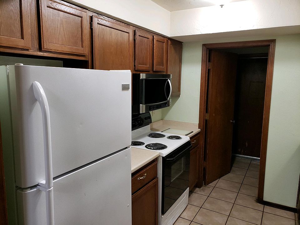 Kitchen, complete with dishwasher, fridge, stove, disposal, microwave