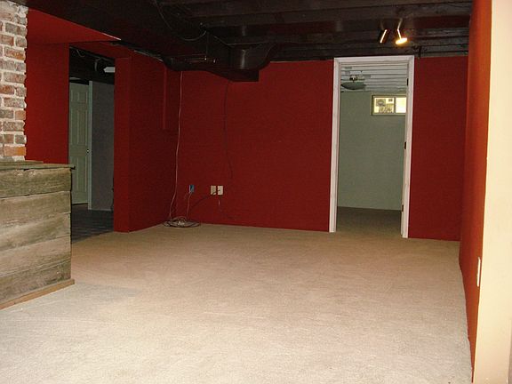 Second living room downstairs with non-conforming bedroom