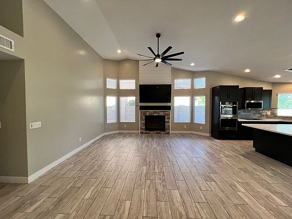 The great room boasts a large family room right beside the spacious kitchen