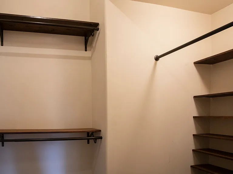 Primary bedroom walk-in closet