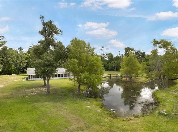 Lots of room for camper or/and boat. Plus beautiful mature Oaks, and Pond.