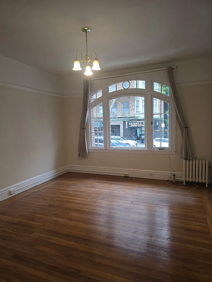 Living room facing window - Bush st apts