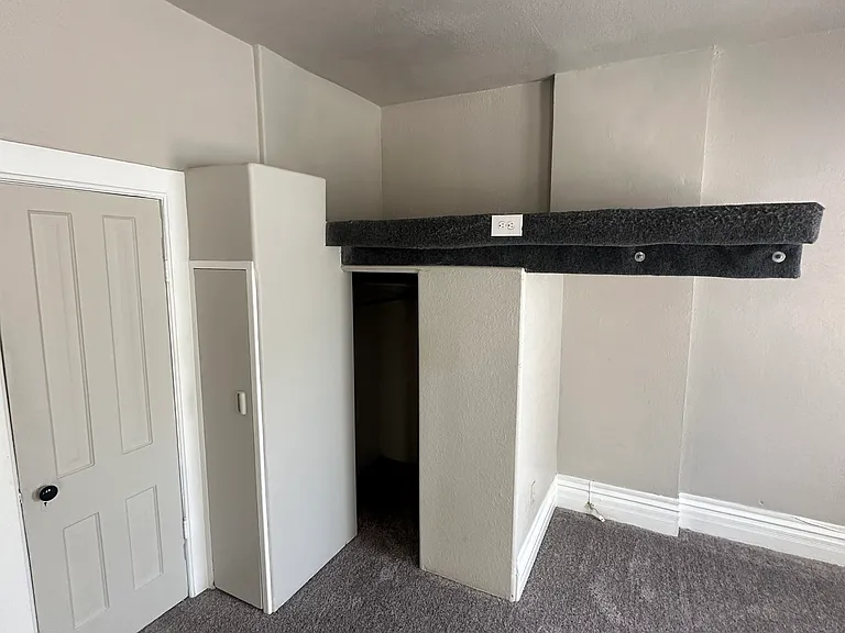 storage, storage shelf and closet and door to the bathroom.