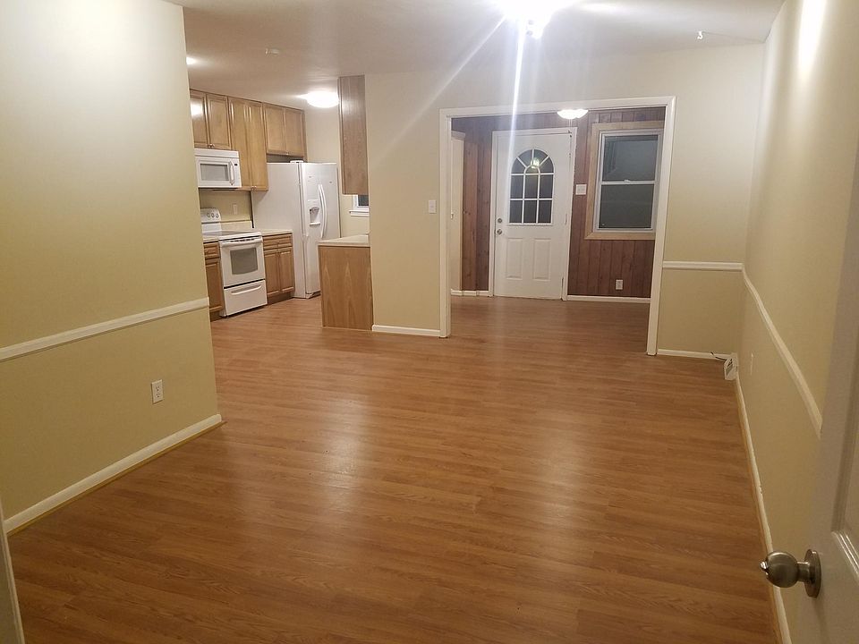 Living room opens to kitchen and dining room