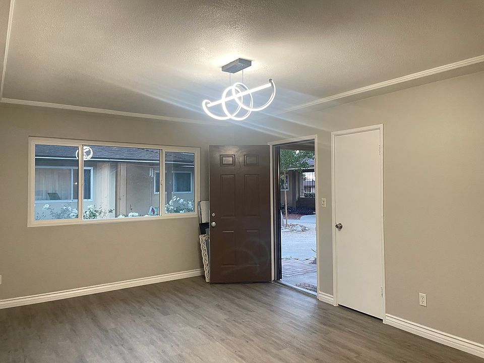 Wide windows in the living room for ample natural light.