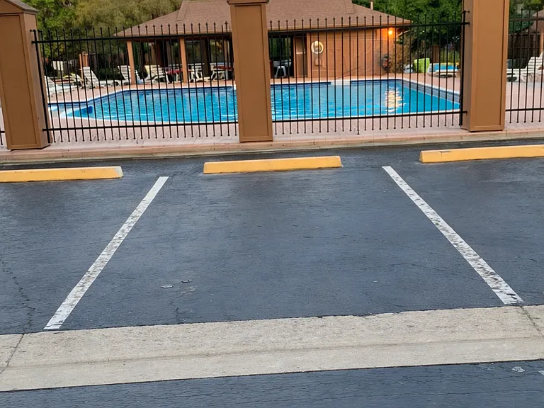 gated pool with extra parking