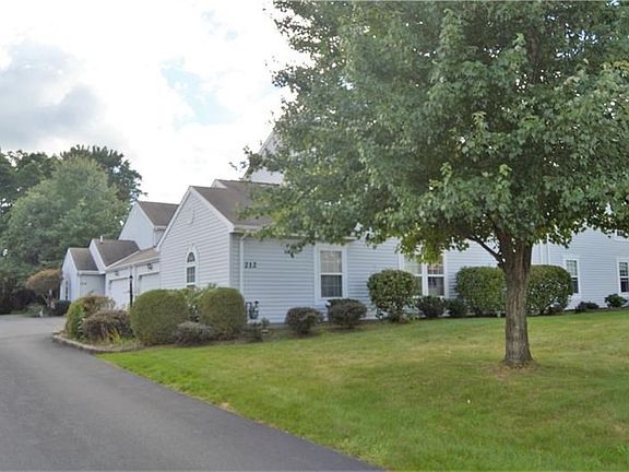 Enjoy your beautiful new yard and landscaping as you enter the driveway of your new maintenance free home.
