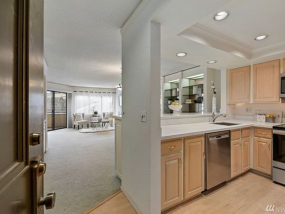 Stylish condo in the heart of Downtown Bellevue. Open flowing layout with 2 bedroom, 1.75 bath, large storage room & 2 parking spots.