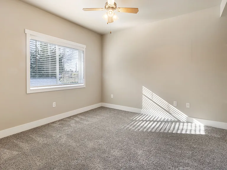 Living in comfort with carpeted bedrooms with ceiling fans