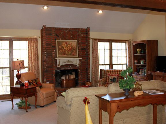 Floor to ceiling brick Fireplace in the cozy living room