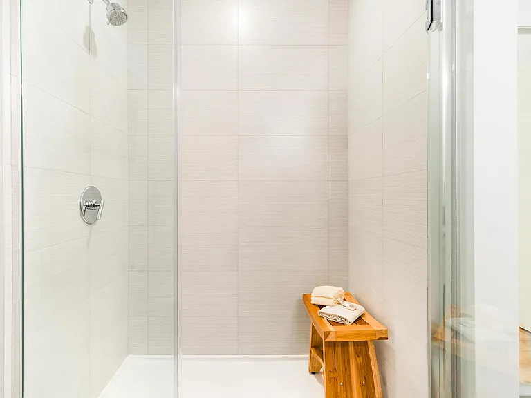A clean, modern shower with sleek finishes and a calming, spa-inspired feel.
