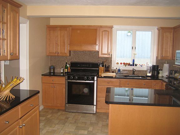 Brand new floor and black granite countertops