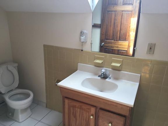 Bathroom off bedroom has a sky light window