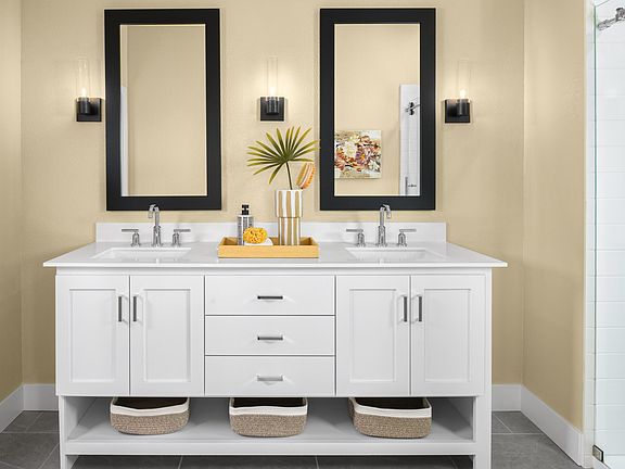 Primary suite freestanding vanity and glass shower enclosure