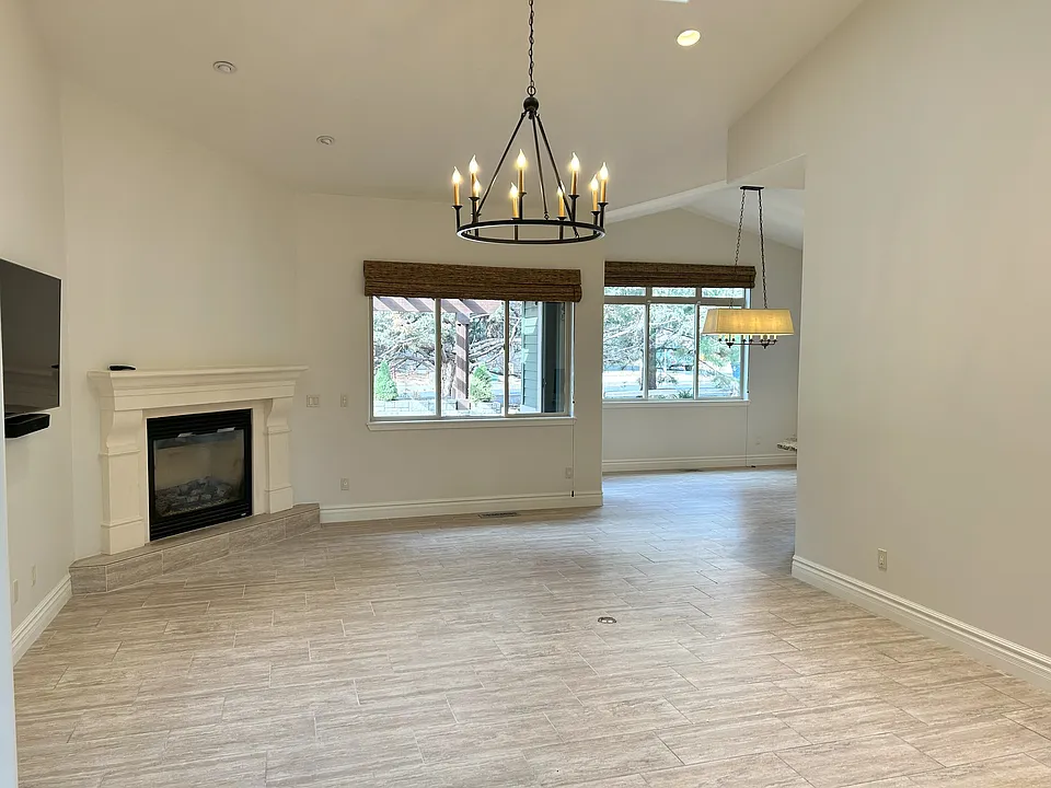 Bright spacious Living Room. Fireplace is now painted black. See next photo.