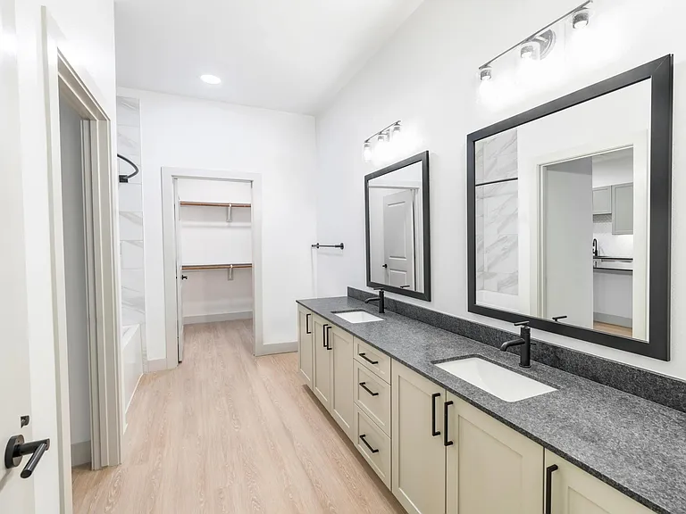 Upgrade your routine with bathrooms featuring double vanities, sleek granite countertops, and designer matte black plumbing fixtures.