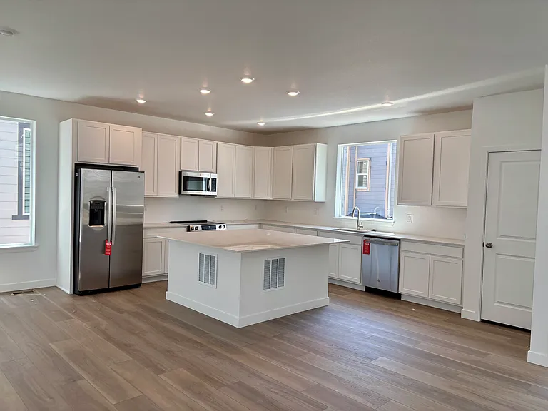 upscale kitchen will and new stainless appliances and island bar seating