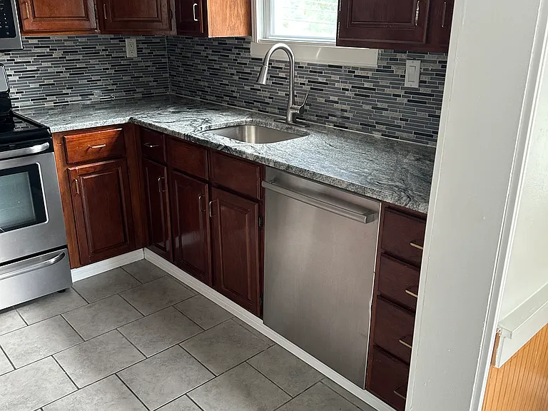 Kitchen, stainless steel appliances, granite countertops, newly stained cabinets