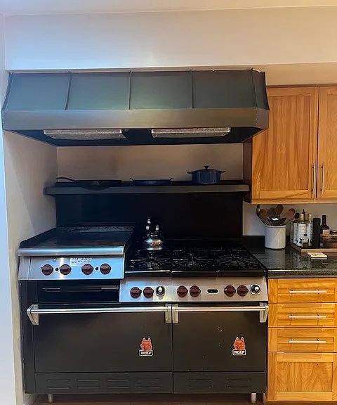 fabulous restaurant style Wolf range with double oven and griddle