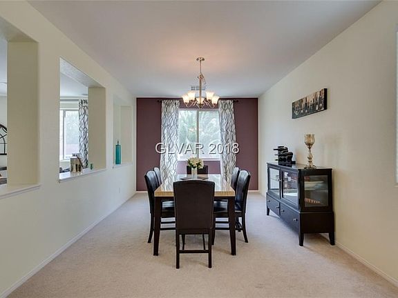 Formal dining room with family room to left