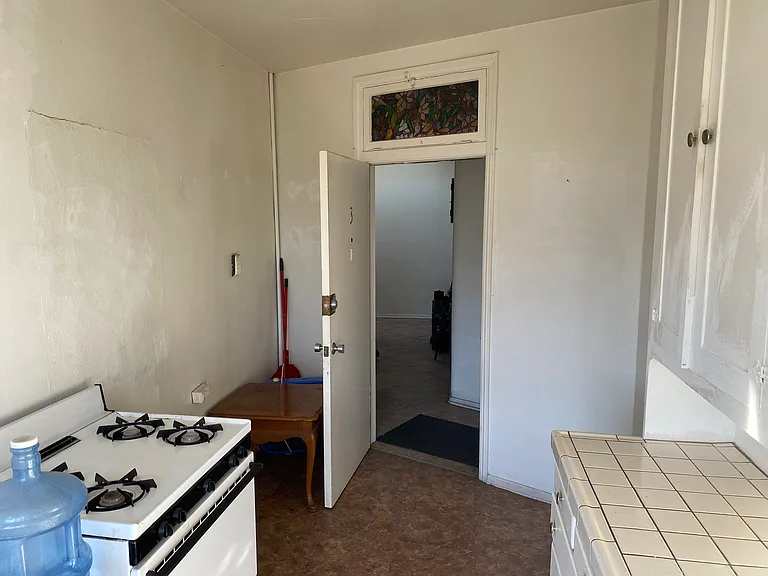Kitchen and apartment front door hallway