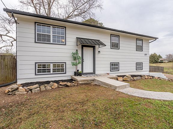Welcoming front entrance with awning. Accessories not included.