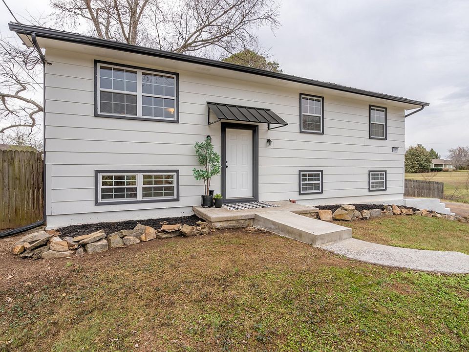 Welcoming front entrance with awning. Accessories not included.