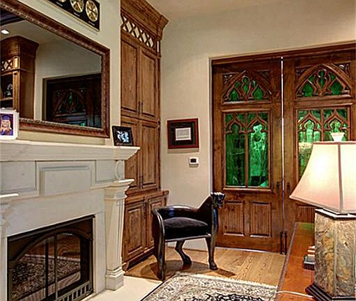 The first-floor office w/built-in, floor-to-ceiling bookcases & cabinets for a clutter-free setting.