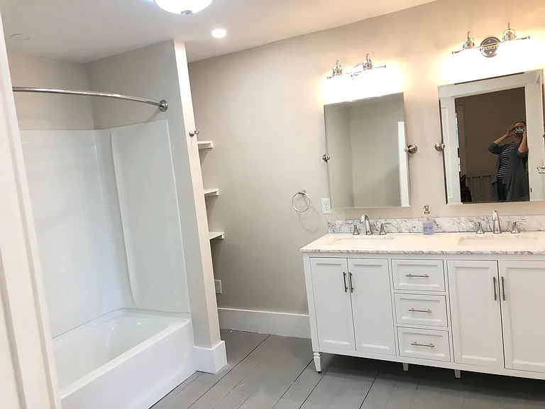 Double marble-topped vanity. Lots of light in this luxurious bathroom!