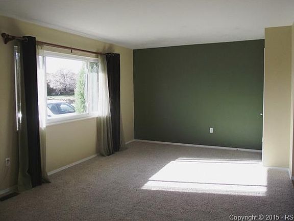 Open floor plan from living/family room to kitchen and dining.