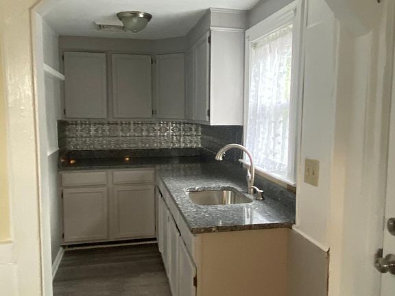 Galley kitchen with new granite counter top