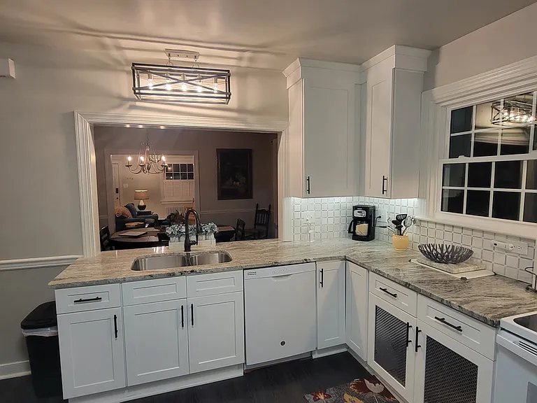 Kitchen with open view to large dining room.