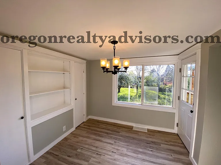 Dining Room with Built-in Pantry and Door to Back Deck