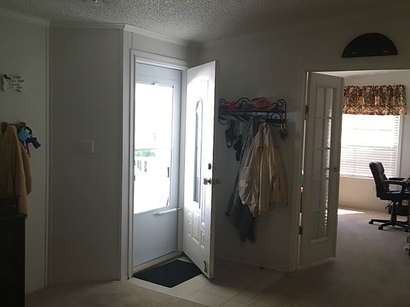 Entryway, looking into den.