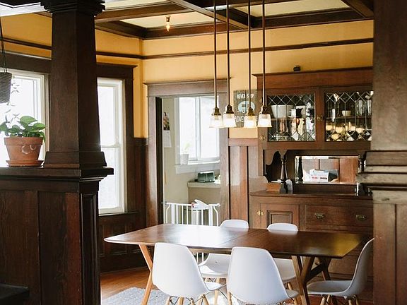 Bright dining room with original box beam ceilings
